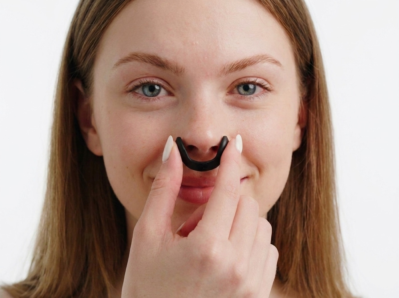 A clip held to the nose at the correct size: each wing just touches the outside of a nostril